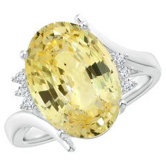 ANGARA Anello in oro bianco con zaffiro giallo naturale e diamante bypassato certificato GIA