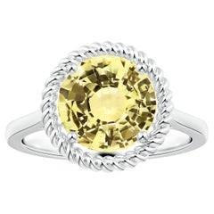 Angara Gia, bague halo en or blanc avec saphir jaune naturel certifié