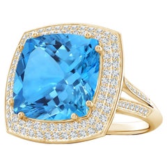 Bague en or jaune avec halo de diamants et topaze bleue suisse certifiée GIA