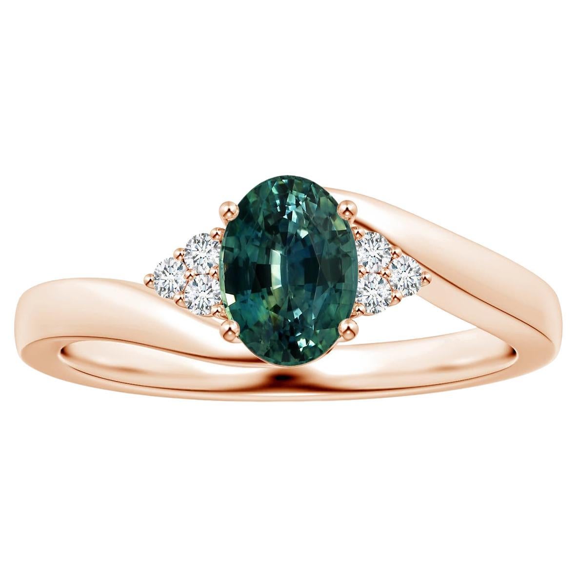 For Sale:  ANGARA GIA Certified Teal Sapphire Bypass Ring in Rose Gold with Diamonds