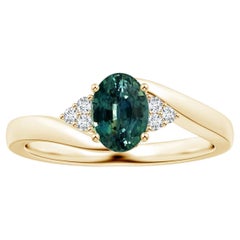 ANGARA GIA Certified Teal Sapphire Bypass Ring in Yellow Gold with Diamonds
