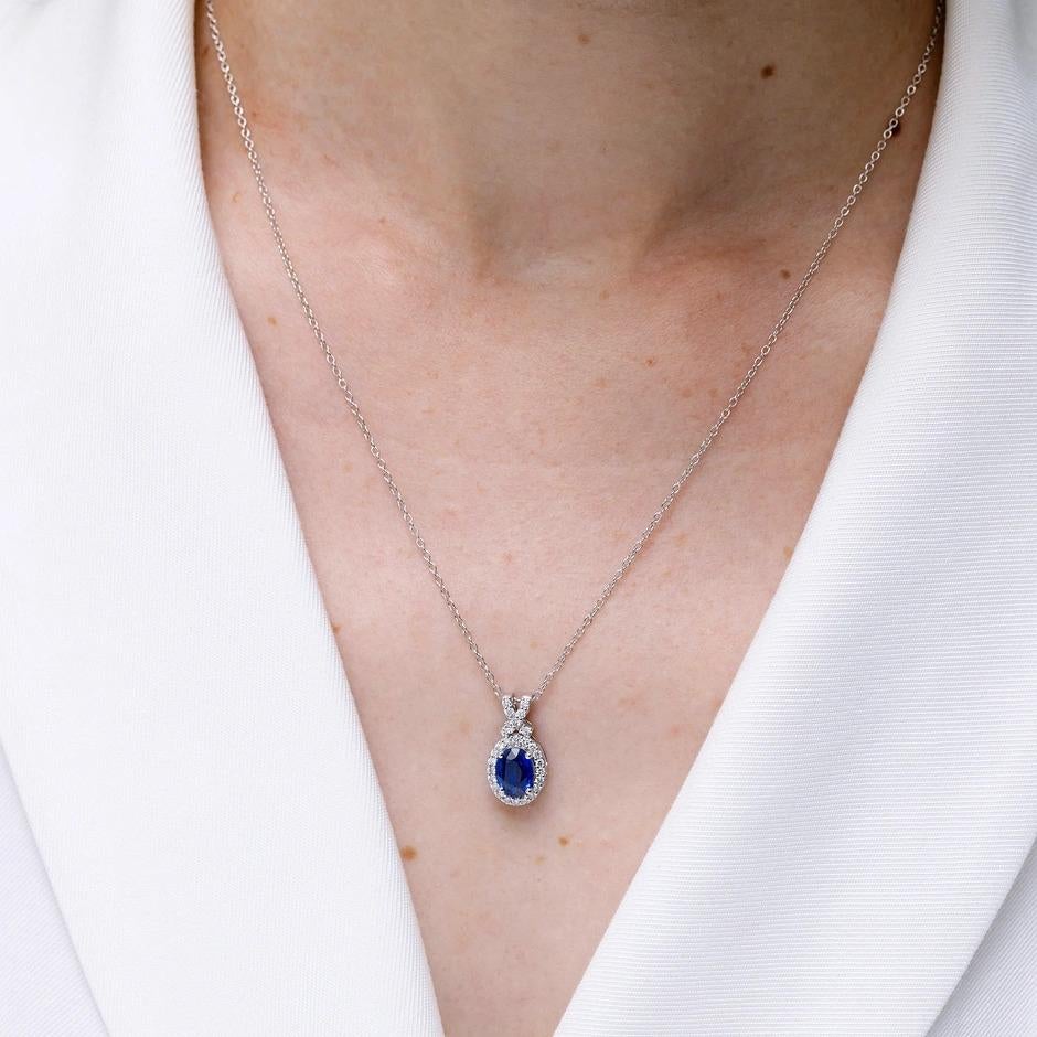 Women's ANGARA Natural 0.60ct Blue Sapphire Pendant with Diamond Halo in 14K White Gold For Sale