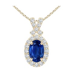 ANGARA Ciondolo con zaffiro blu naturale da 0,60 carati e aureola di diamanti in oro giallo 14K