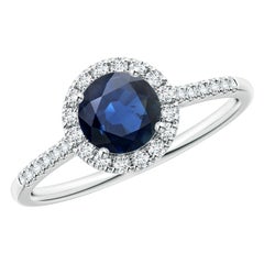 Angara Anillo de compromiso con halo de zafiro azul natural de 1 ct con diamante en oro de 14 quilates