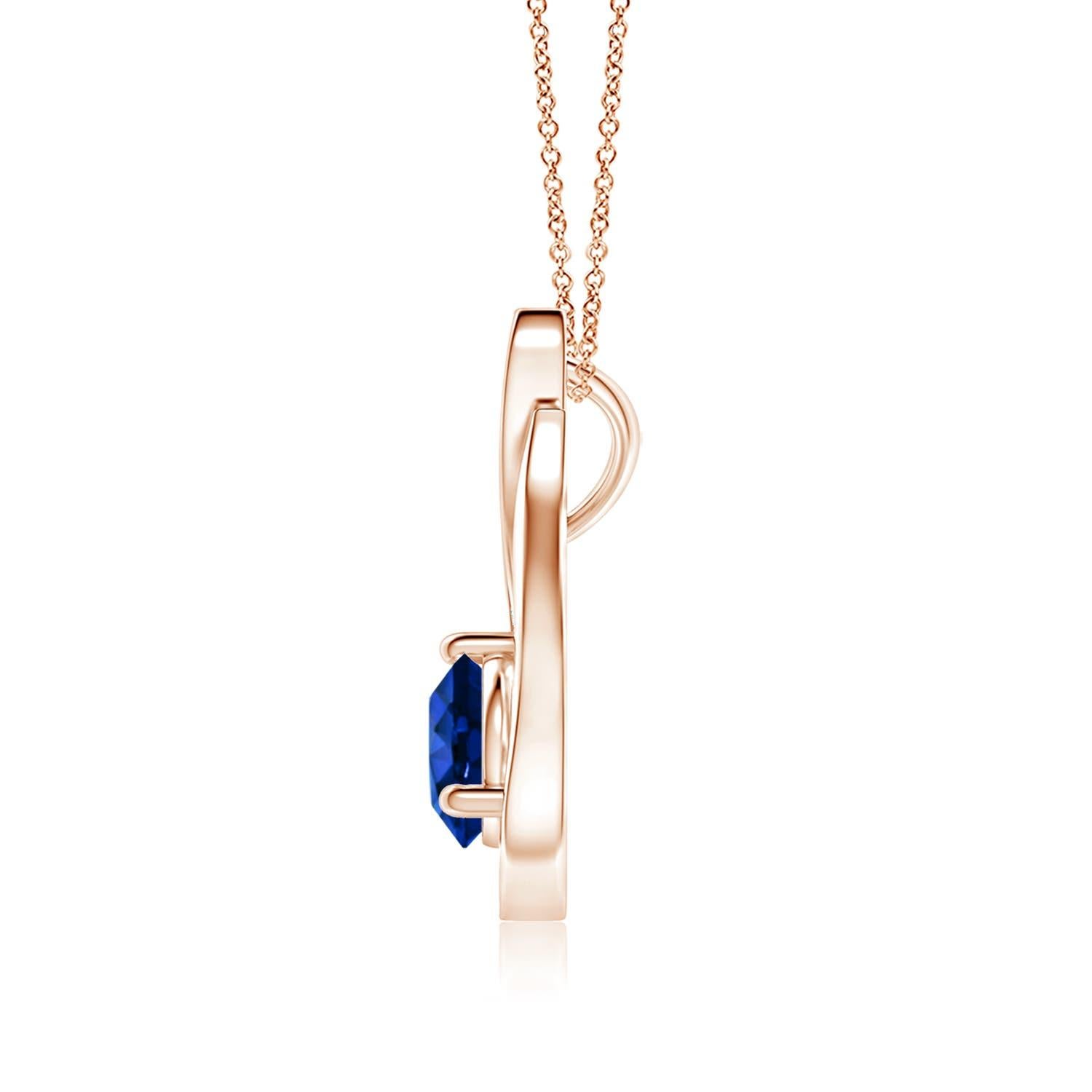 Pendentif tulipe en or rose 14 carats orné d'un saphir bleu qui vous envoûtera par son éclat divin. Le modèle présente un saphir rond serti sur un anneau et des accents de diamants qui complètent magnifiquement l'éclat de la pierre précieuse,