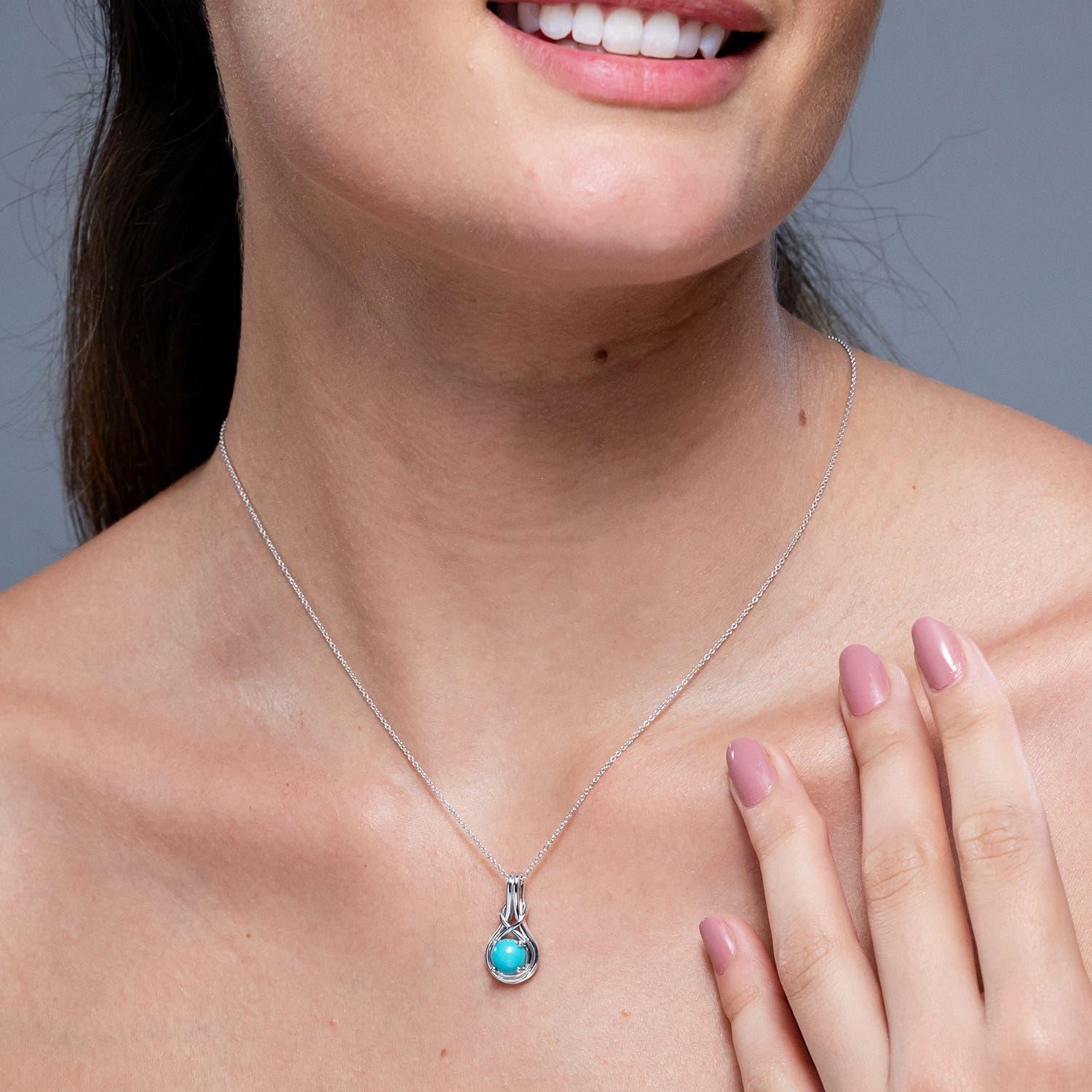 Modern Angara Natural 1.1ct Turquoise Solitaire Infinity Knot Pendant in 14K Solid Gold For Sale