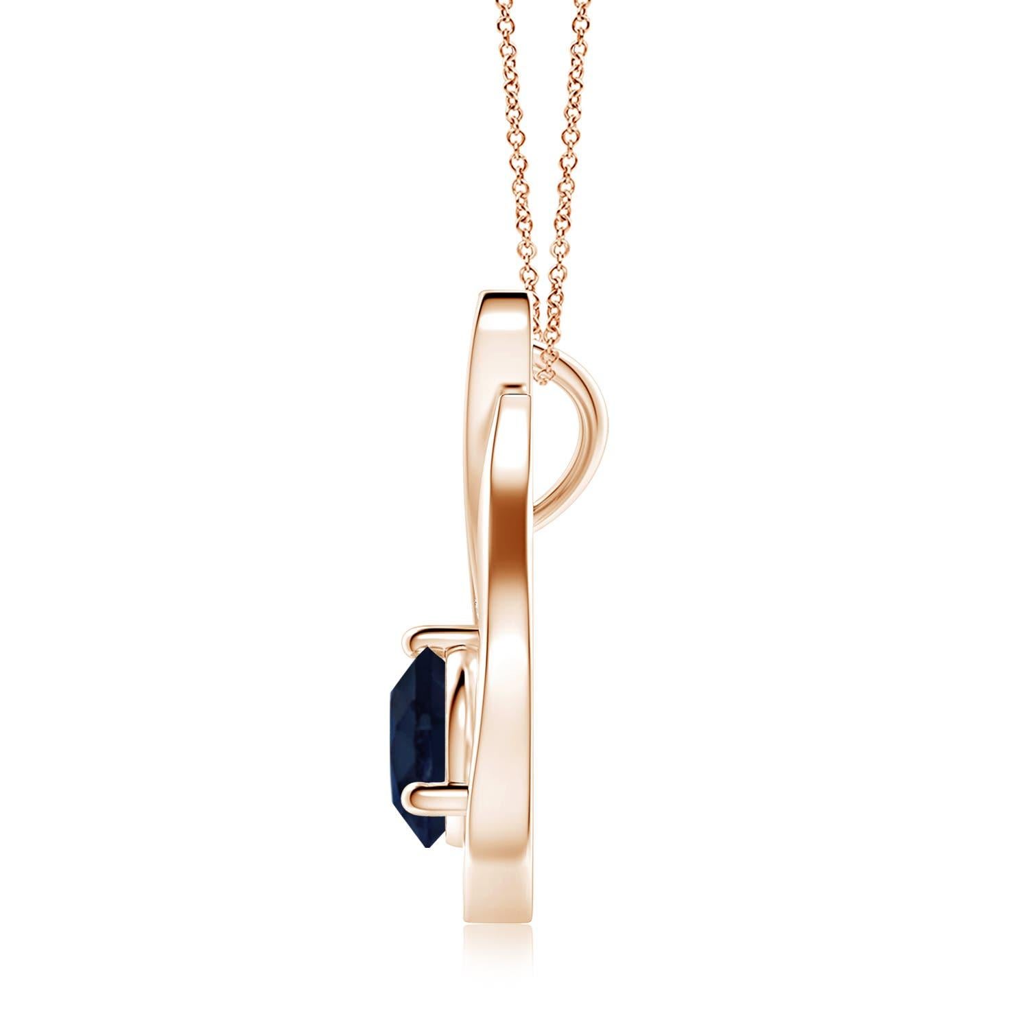 Pendentif tulipe en or rose 14 carats orné d'un saphir bleu qui vous envoûtera par son éclat divin. Le modèle présente un saphir rond serti sur un anneau et des accents de diamant qui complètent magnifiquement l'éclat de la pierre précieuse,