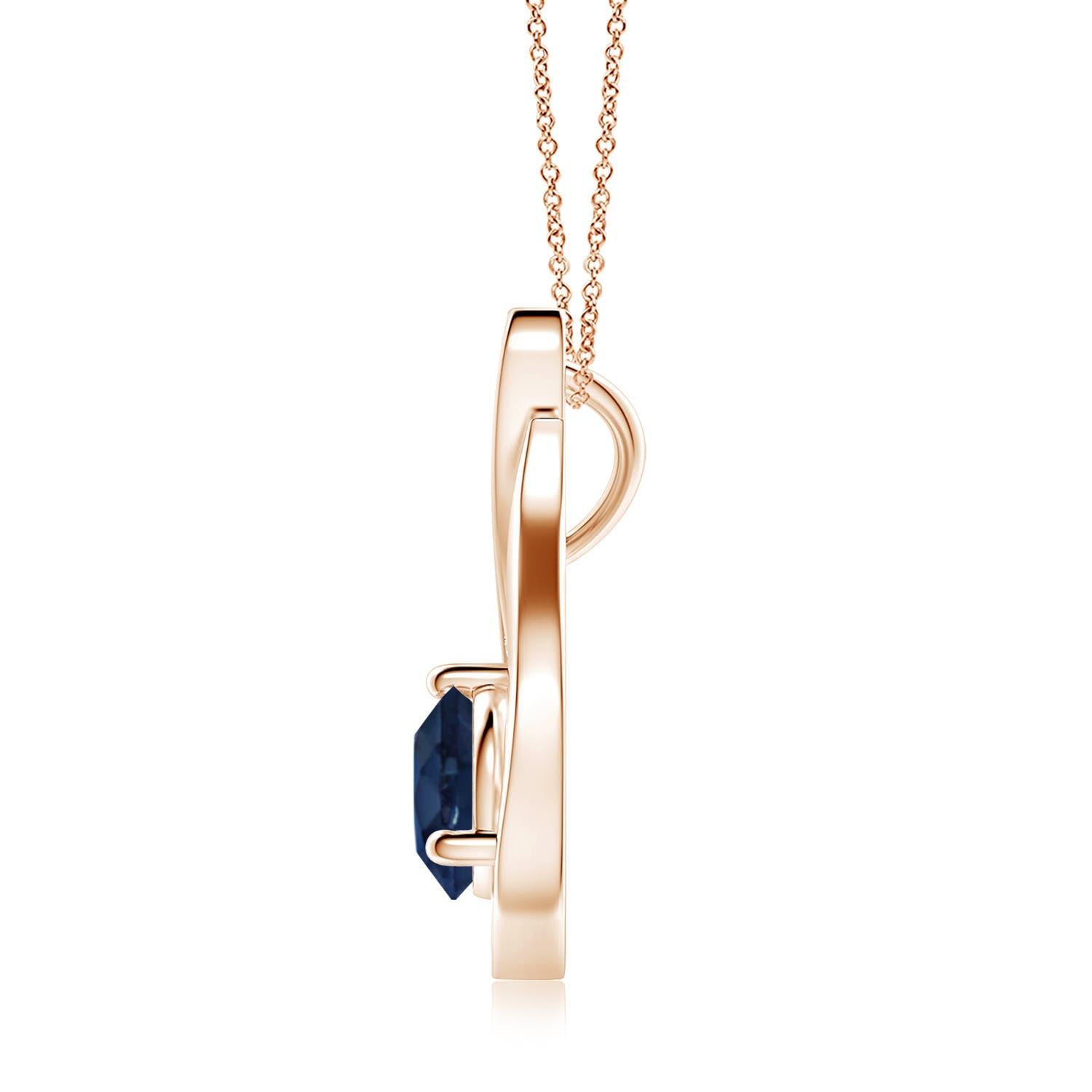Pendentif tulipe en or rose 14 carats orné d'un saphir bleu qui vous envoûtera par son éclat divin. Le modèle présente un saphir rond serti sur un anneau et des accents de diamant qui complètent magnifiquement l'éclat de la pierre précieuse,