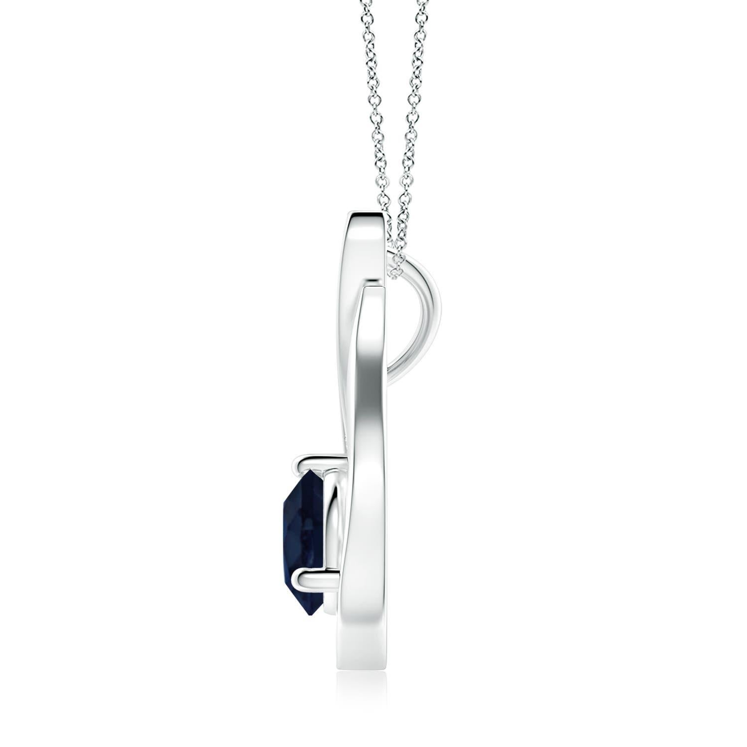 Un ciondolo a tulipano in oro bianco 14k con uno zaffiro blu che ti ipnotizzerà con il suo splendore divino. Il design è caratterizzato da uno zaffiro rotondo incastonato e da accenti di diamanti che completano splendidamente lo scintillio della