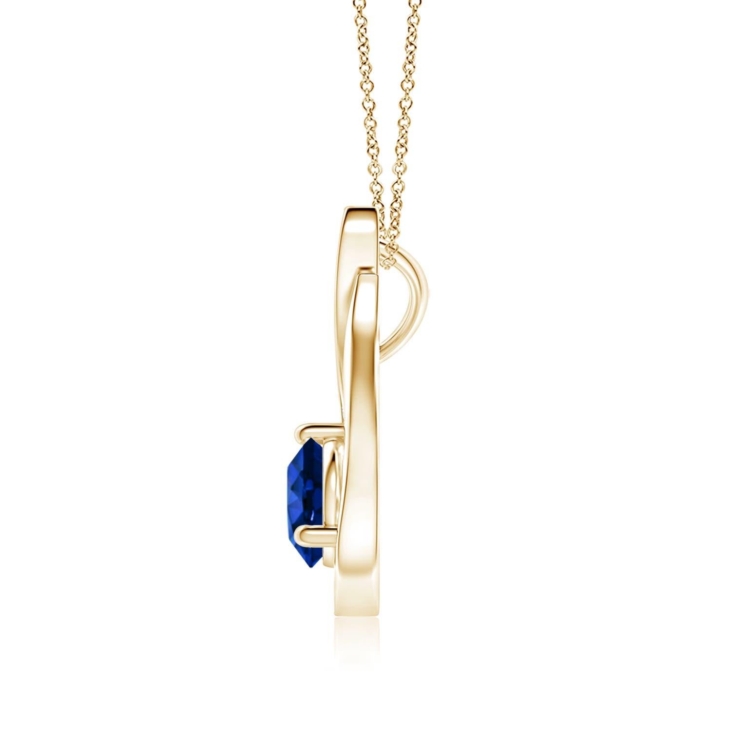 Pendentif tulipe en or jaune 14 carats orné d'un saphir bleu qui vous envoûtera par son éclat divin. Le modèle présente un saphir rond serti sur un anneau et des accents de diamant qui complètent magnifiquement l'éclat de la pierre précieuse,