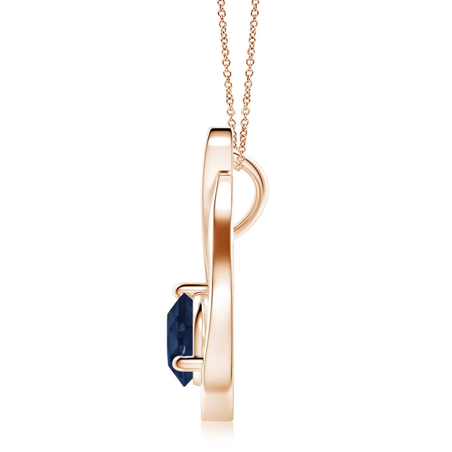 Pendentif tulipe en or rose 14 carats orné d'un saphir bleu qui vous envoûtera par son éclat divin. Le modèle présente un saphir rond serti sur un anneau et des accents de diamant qui complètent magnifiquement l'éclat de la pierre précieuse,