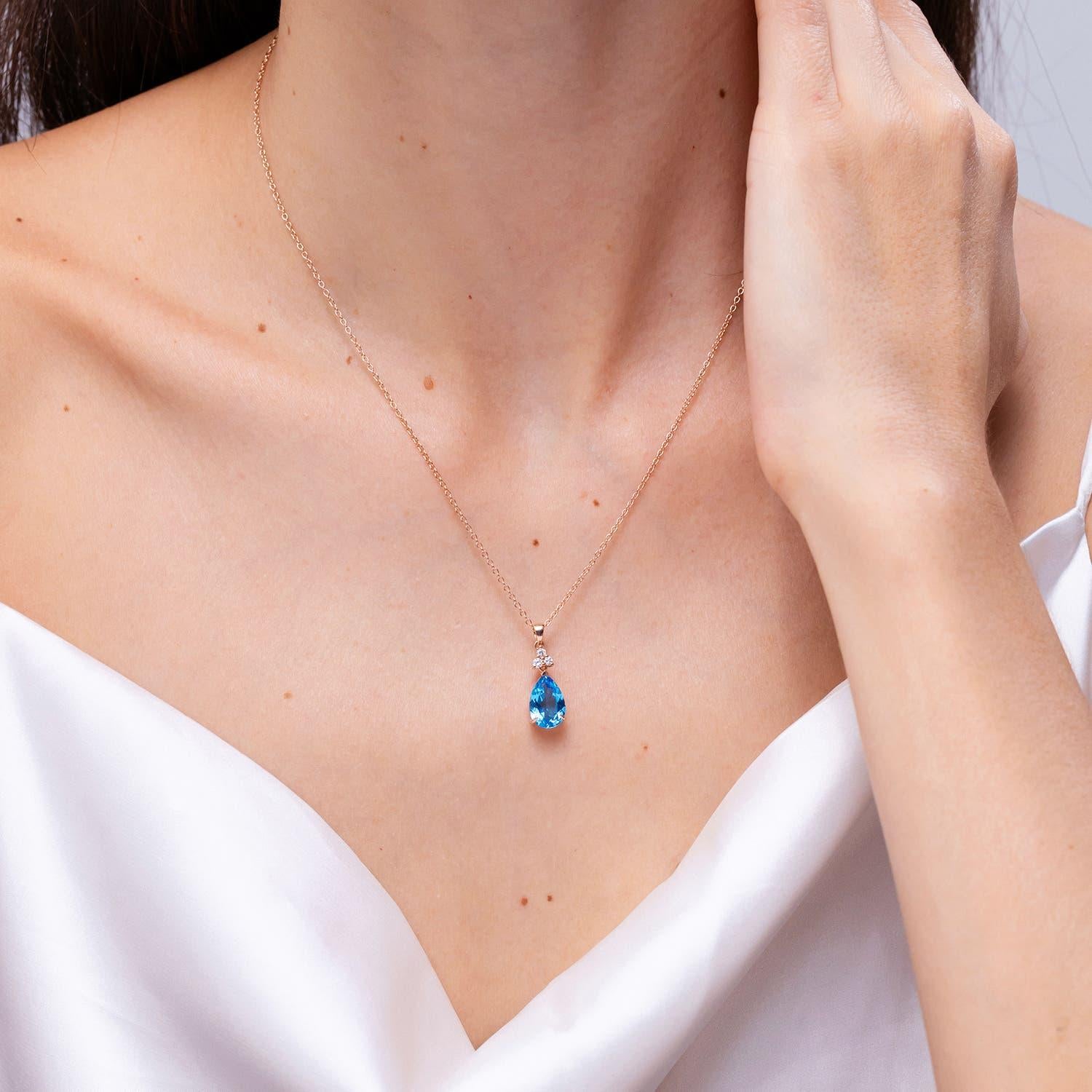 Modern Angara Natural 3.8ct Swiss Blue Topaz Drop Pendant with Diamonds 14K Solid Gold For Sale