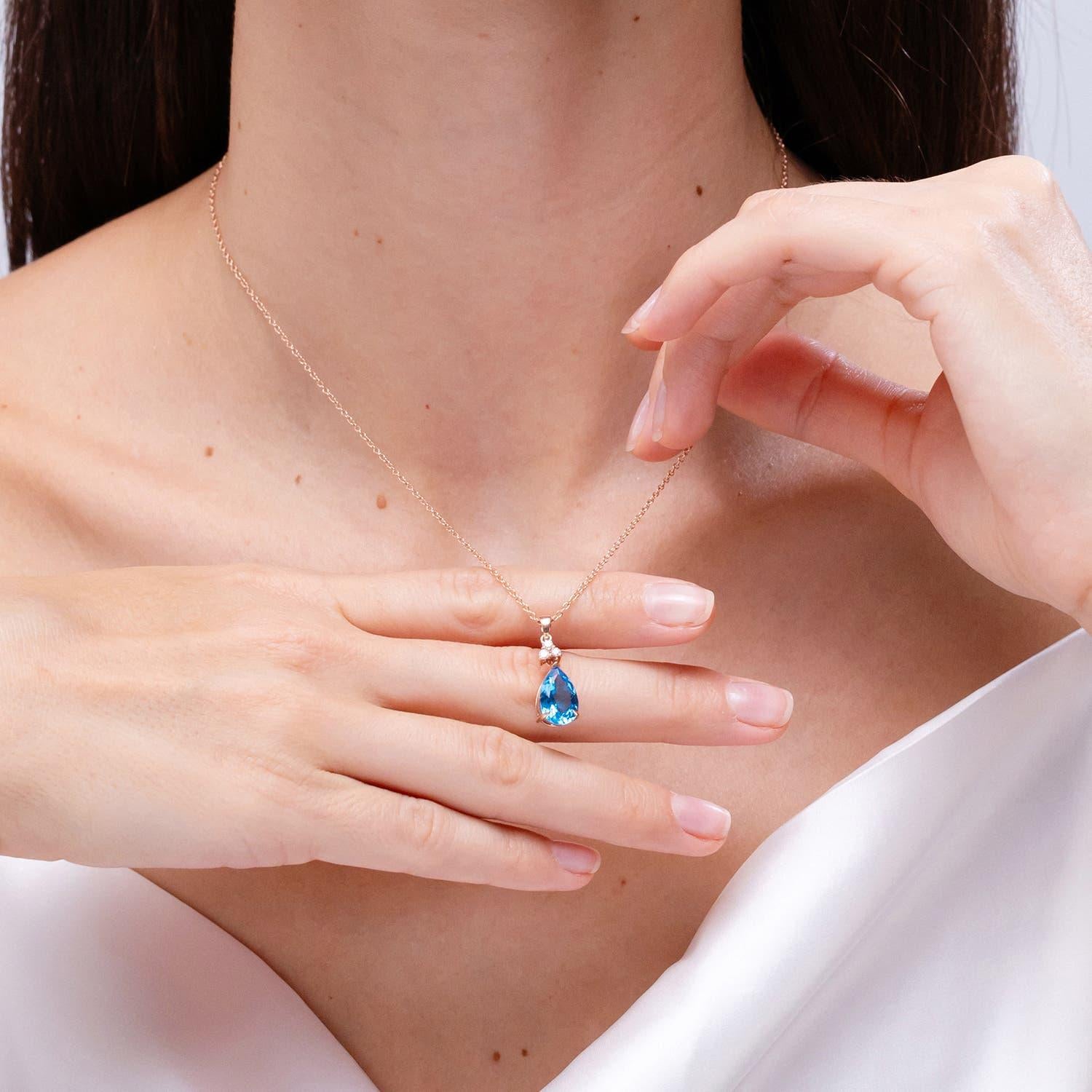 Angara Natural 3.8ct Swiss Blue Topaz Drop Pendant with Diamonds 14K Solid Gold In New Condition For Sale In Los Angeles, CA