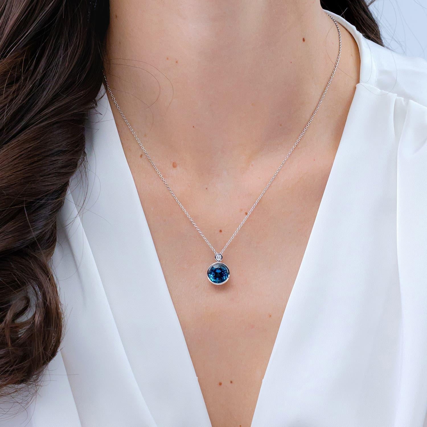 Modern Angara Natural Bezel 4.2ct London Blue Topaz Solitaire Pendant in 14K Solid Gold For Sale