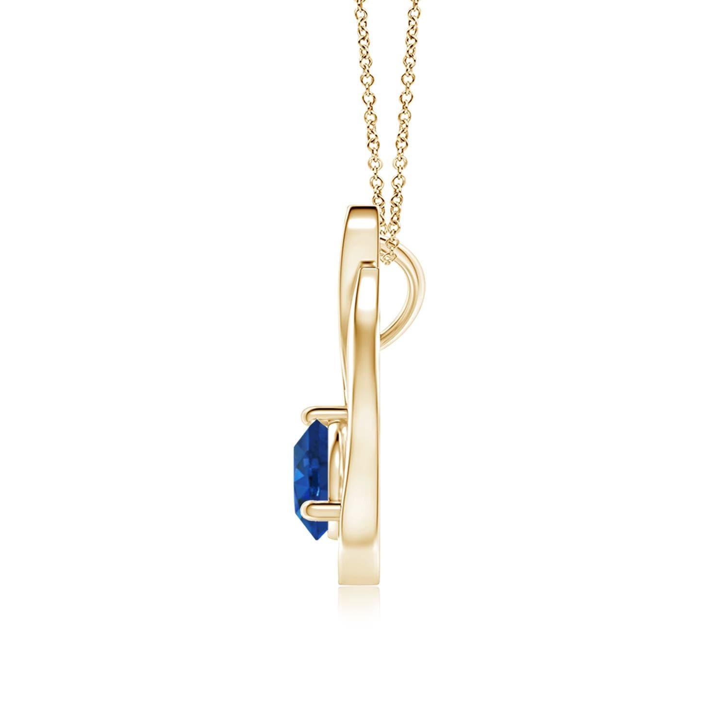 Pendentif tulipe en or jaune 14 carats orné d'un saphir bleu qui vous envoûtera par son éclat divin. Le modèle présente un saphir rond serti sur un anneau et des accents de diamant qui complètent magnifiquement l'éclat de la pierre précieuse,