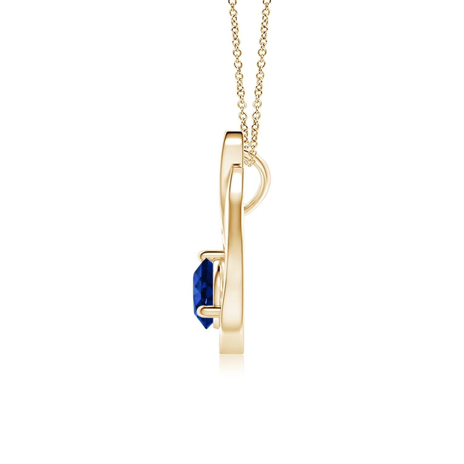 Pendentif tulipe en or jaune 14 carats orné d'un saphir bleu qui vous envoûtera par son éclat divin. Le modèle présente un saphir rond serti sur un anneau et des accents de diamant qui complètent magnifiquement l'éclat de la pierre précieuse,