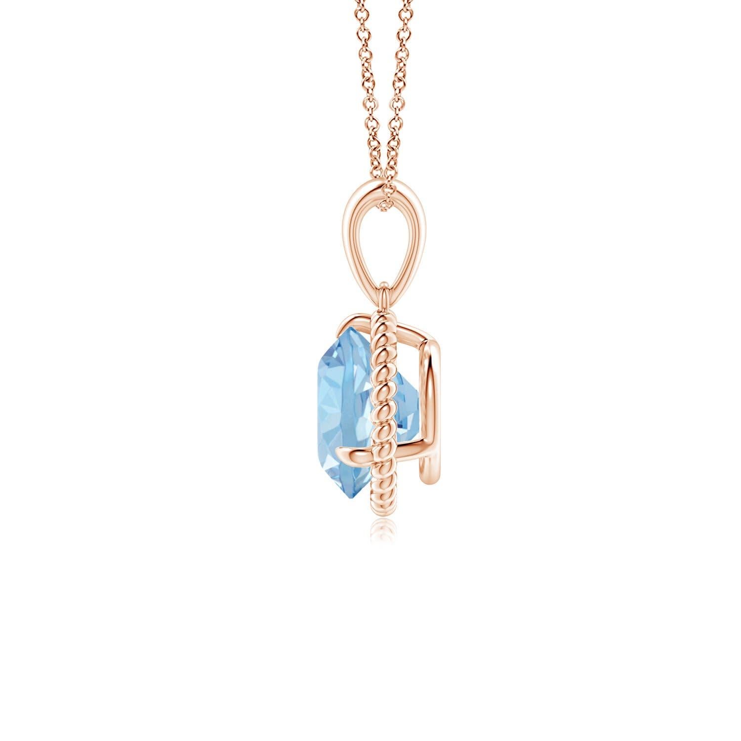 Eleganza e semplicità, questo ciondolo con solitario di acquamarina è realizzato in oro rosa 14k. L'acquamarina rotonda con artiglio incastonato è circondata da una cornice di corda attorcigliata che conferisce un tocco di unicità al
