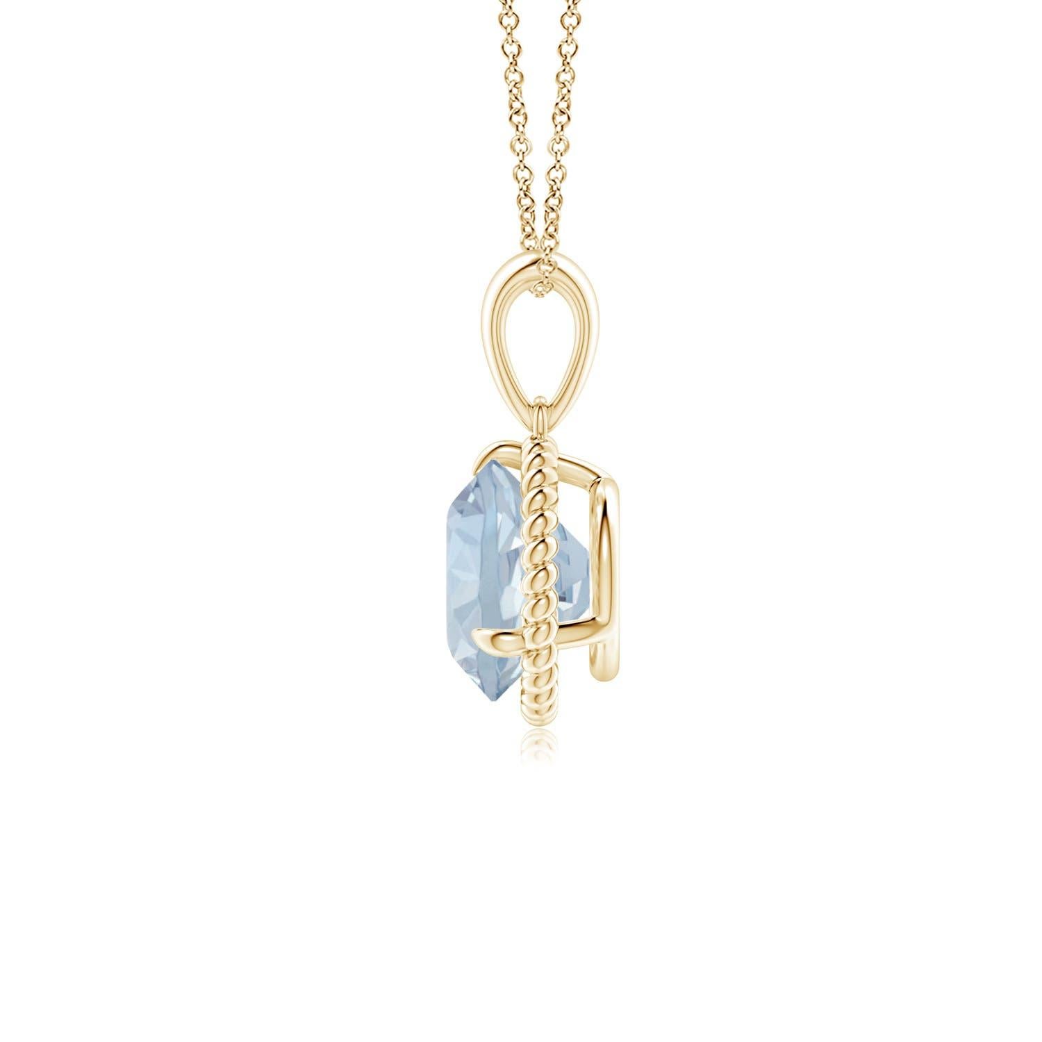 Eleganza e semplicità, questo ciondolo con solitario di acquamarina è realizzato in oro giallo 14k. L'acquamarina rotonda con artiglio incastonato è circondata da una cornice di corda attorcigliata che conferisce un tocco di unicità al