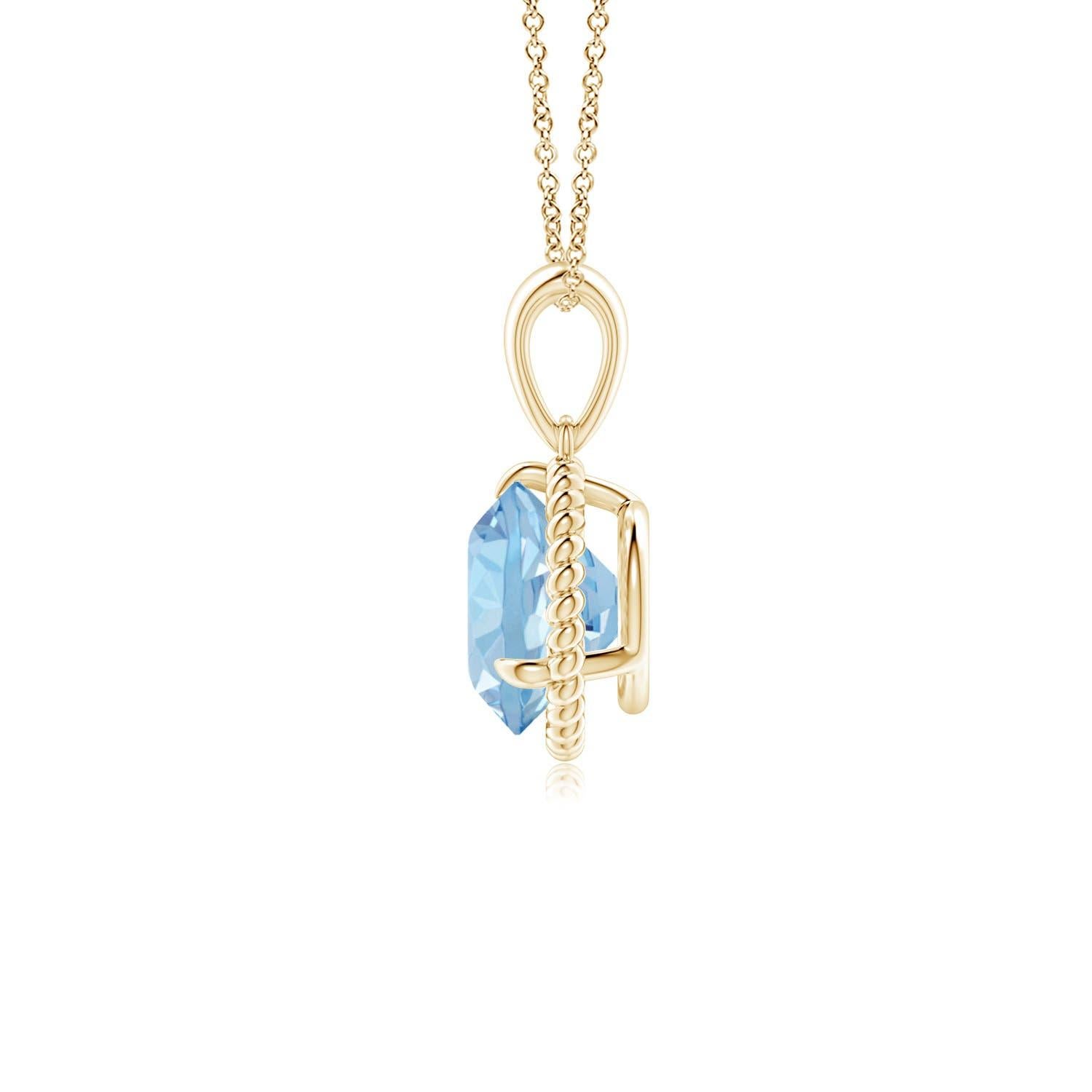 Eleganza e semplicità, questo ciondolo con solitario di acquamarina è realizzato in oro giallo 14k. L'acquamarina rotonda con artiglio incastonato è circondata da una cornice di corda attorcigliata che conferisce un tocco di unicità al