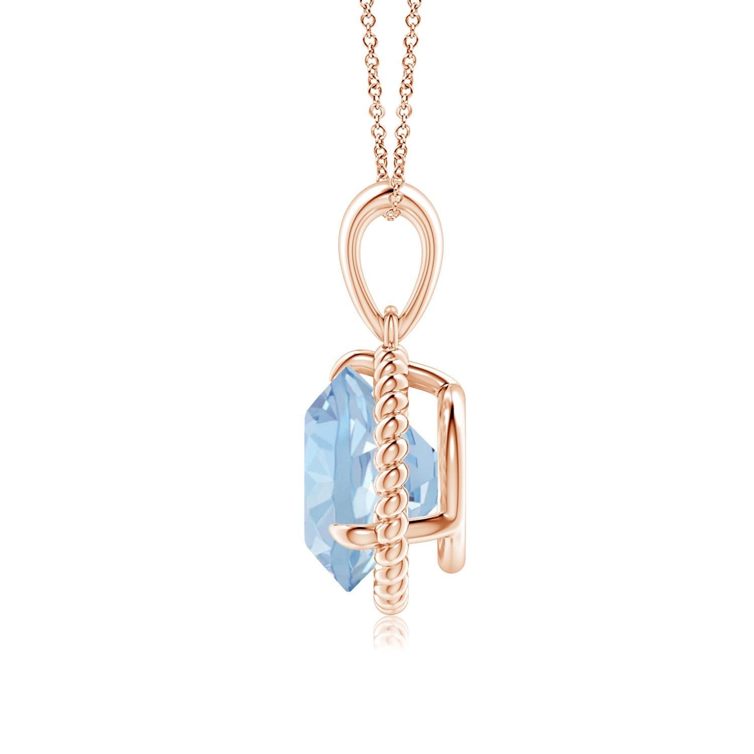 Eleganza e semplicità, questo ciondolo con solitario di acquamarina è realizzato in oro rosa 14k. L'acquamarina rotonda con artiglio incastonato è circondata da una cornice di corda attorcigliata che conferisce un tocco di unicità al