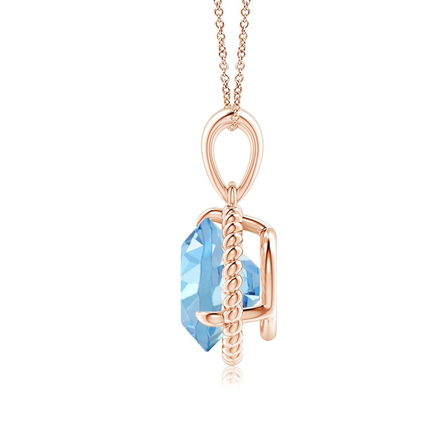 Eleganza e semplicità, questo ciondolo con solitario di acquamarina è realizzato in oro rosa 14k. L'acquamarina rotonda con artiglio incastonato è circondata da una cornice di corda attorcigliata che conferisce un tocco di unicità al