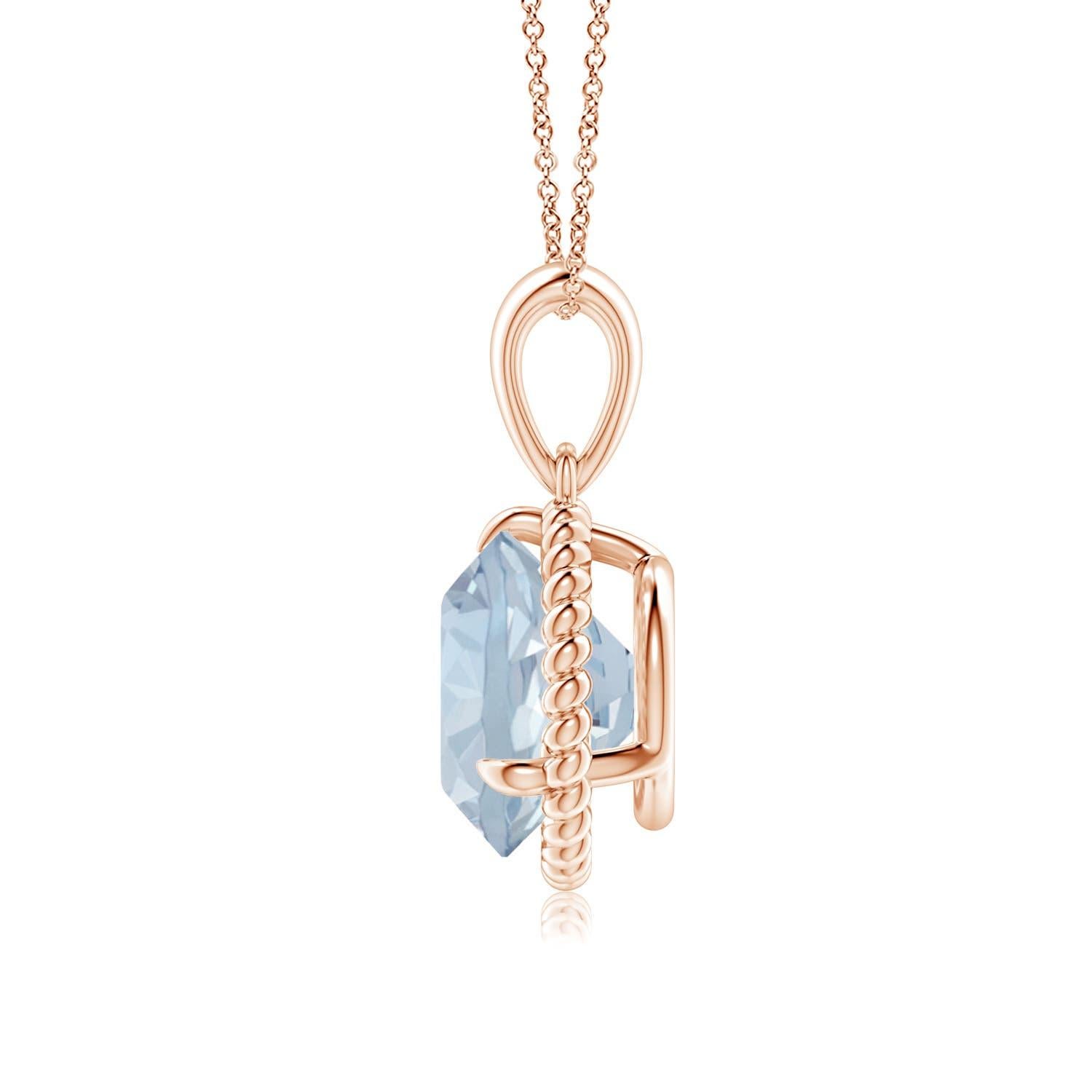Eleganza e semplicità, questo ciondolo con solitario di acquamarina è realizzato in oro rosa 14k. L'acquamarina rotonda con artiglio incastonato è circondata da una cornice di corda attorcigliata che conferisce un tocco di unicità al