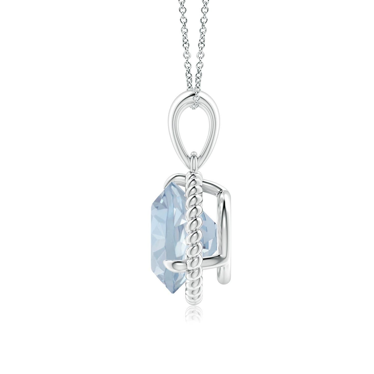 Eleganza e semplicità, questo ciondolo con solitario di acquamarina è realizzato in oro bianco 14k. L'acquamarina rotonda con artiglio incastonato è circondata da una cornice di corda attorcigliata che conferisce un tocco di unicità al