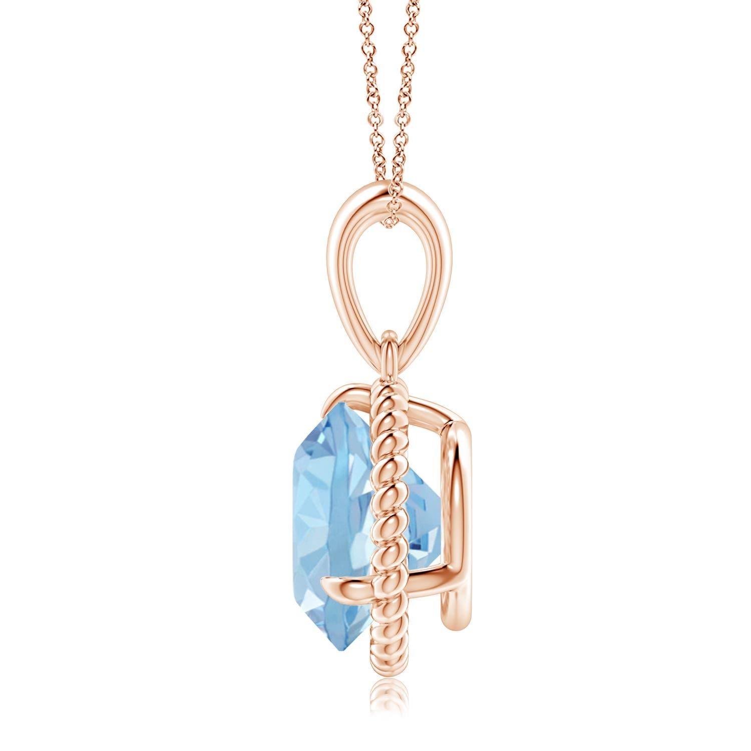 Eleganza e semplicità, questo ciondolo con solitario di acquamarina è realizzato in oro rosa 14k. L'acquamarina rotonda con artiglio incastonato è circondata da una cornice di corda attorcigliata che conferisce un tocco di unicità al