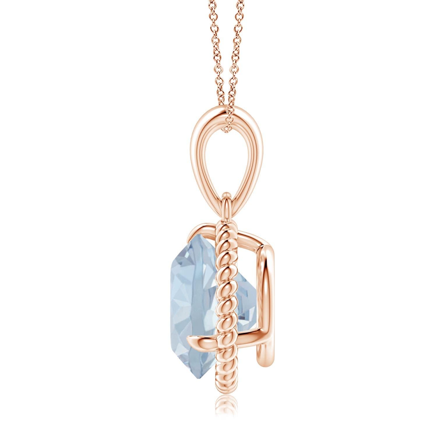 Eleganza e semplicità, questo ciondolo con solitario di acquamarina è realizzato in oro rosa 14k. L'acquamarina rotonda con artiglio incastonato è circondata da una cornice di corda attorcigliata che conferisce un tocco di unicità al