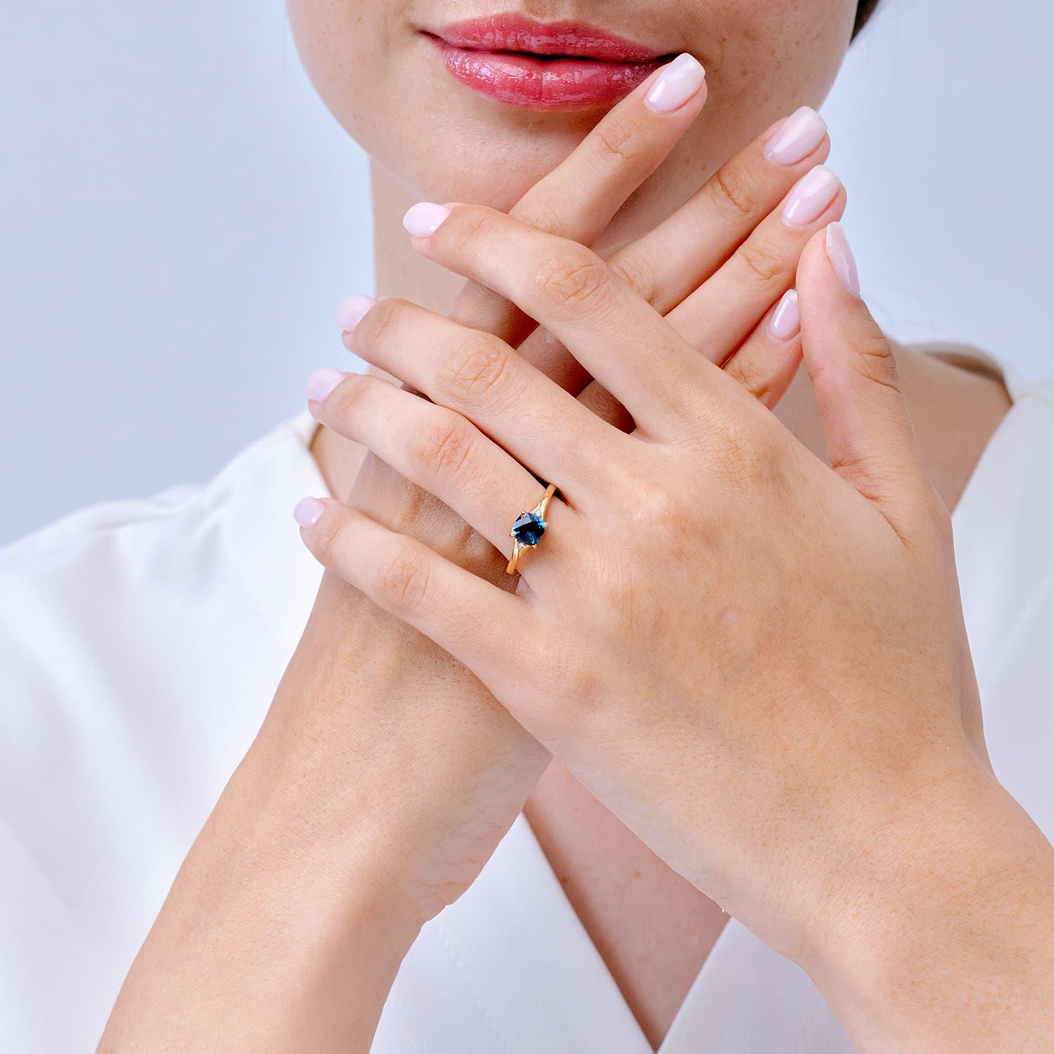 Modern Angara Natural Cushion 1.1 ct London Blue Topaz Solitaire Ring in 14K Solid Gold For Sale