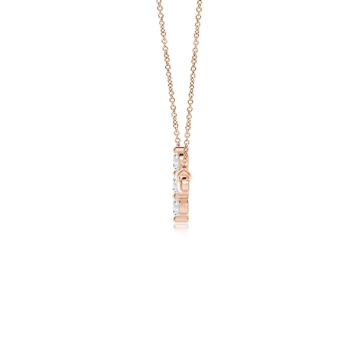 Hanging sideways from a chain is the gorgeous cross pendant crafted in 14k rose gold. The vertical bar of the cross is adorned with three white diamonds in prong setting. The sparkling diamonds lend an impeccable dazzling effect to this lustrous