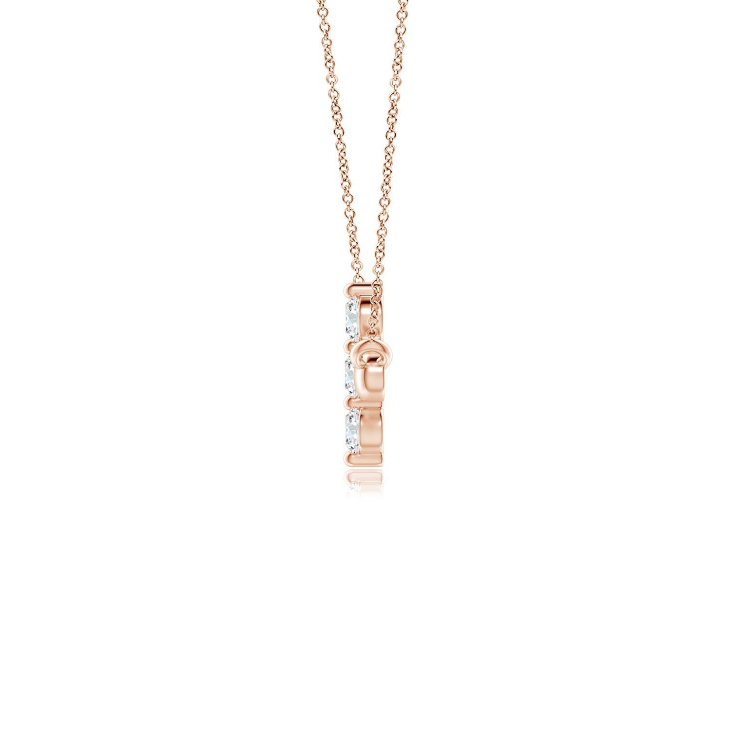 Hanging sideways from a chain is the gorgeous cross pendant crafted in 14k rose gold. The vertical bar of the cross is adorned with three white diamonds in prong setting. The sparkling diamonds lend an impeccable dazzling effect to this lustrous