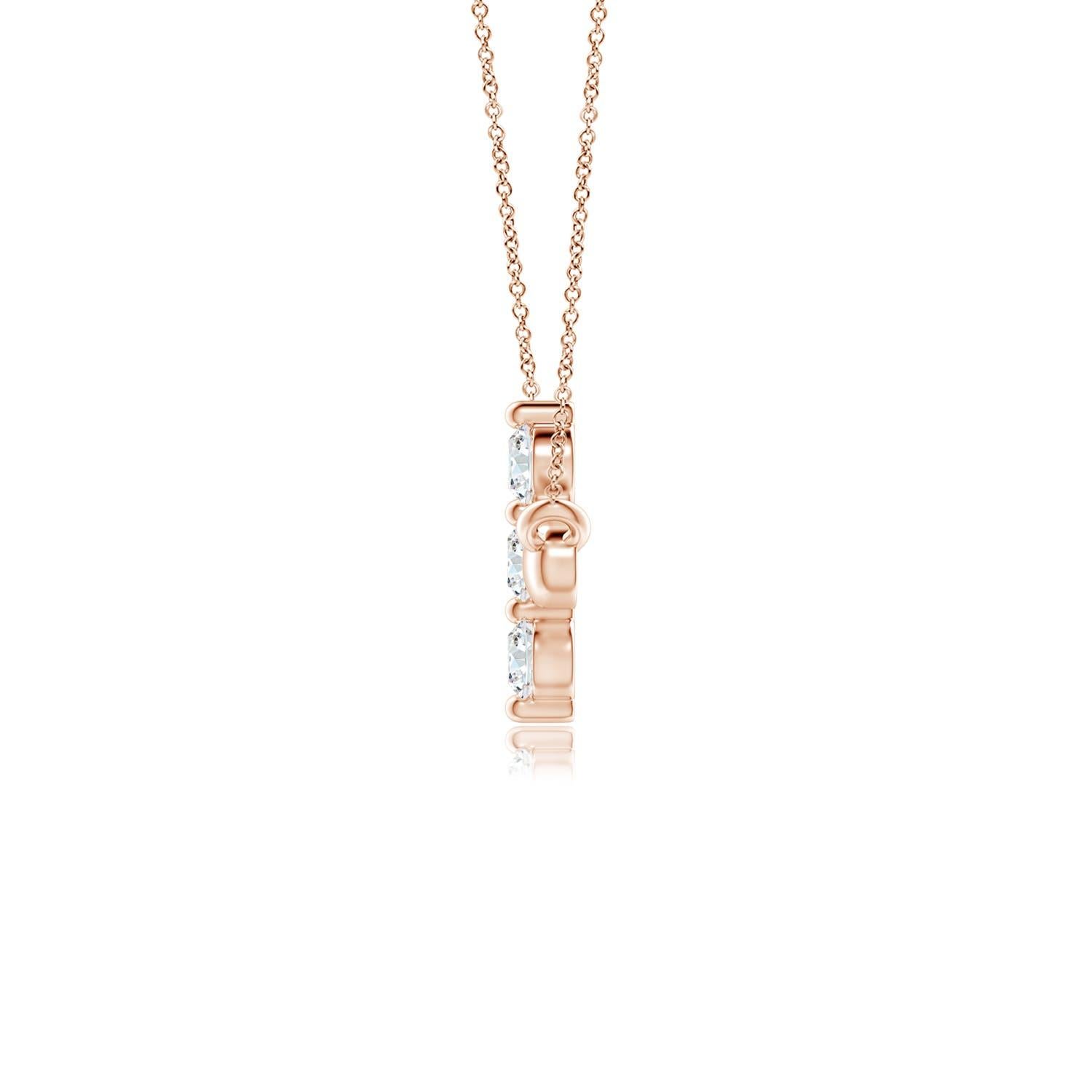 Hanging sideways from a chain is the gorgeous cross pendant crafted in 14k rose gold. The vertical bar of the cross is adorned with three white diamonds in prong setting. The sparkling diamonds lend an impeccable dazzling effect to this lustrous