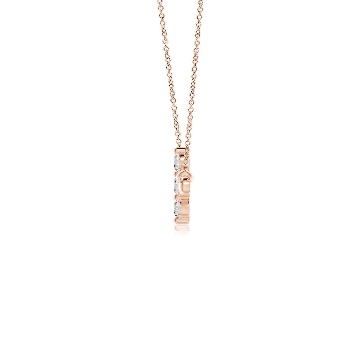 Hanging sideways from a chain is the gorgeous cross pendant crafted in 14k rose gold. The vertical bar of the cross is adorned with three white diamonds in prong setting. The sparkling diamonds lend an impeccable dazzling effect to this lustrous