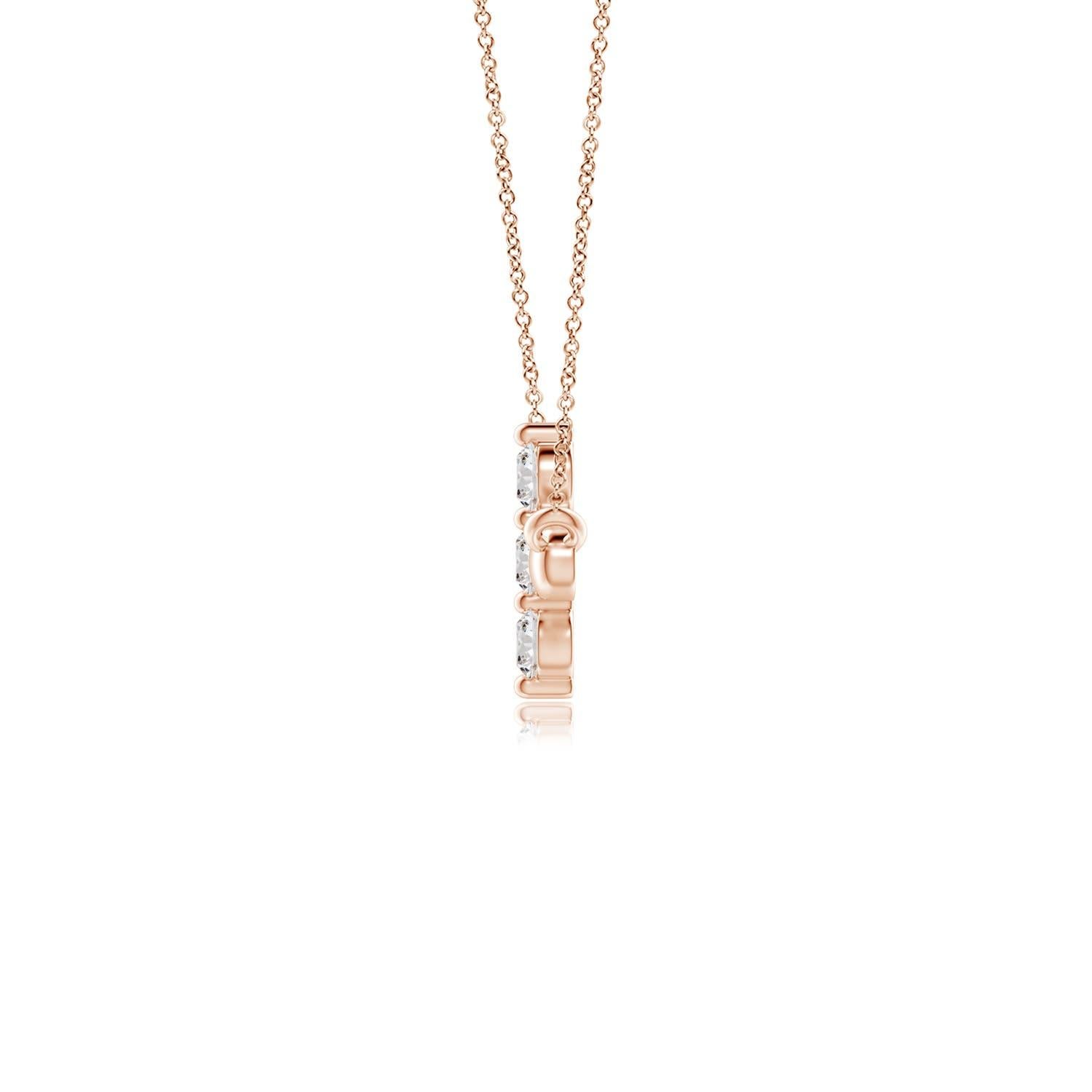 Hanging sideways from a chain is the gorgeous cross pendant crafted in 14k rose gold. The vertical bar of the cross is adorned with three white diamonds in prong setting. The sparkling diamonds lend an impeccable dazzling effect to this lustrous