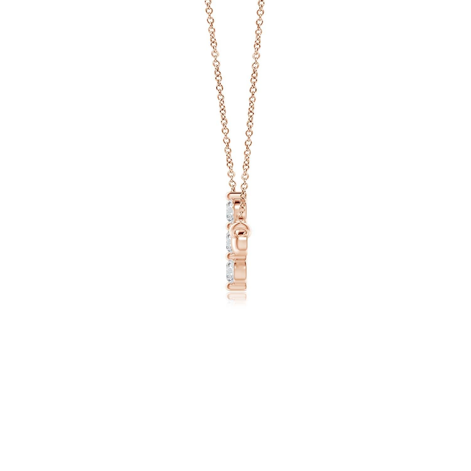 Hanging sideways from a chain is the gorgeous cross pendant crafted in 14k rose gold. The vertical bar of the cross is adorned with three white diamonds in prong setting. The sparkling diamonds lend an impeccable dazzling effect to this lustrous