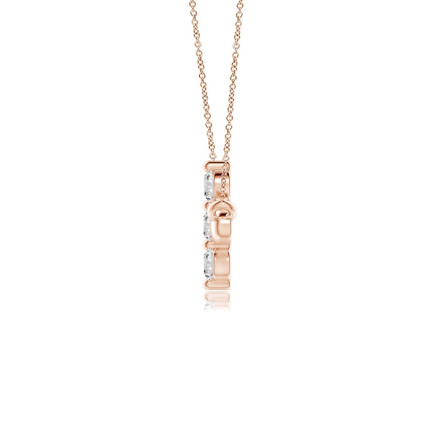 Hanging sideways from a chain is the gorgeous cross pendant crafted in 14k rose gold. The vertical bar of the cross is adorned with three white diamonds in prong setting. The sparkling diamonds lend an impeccable dazzling effect to this lustrous