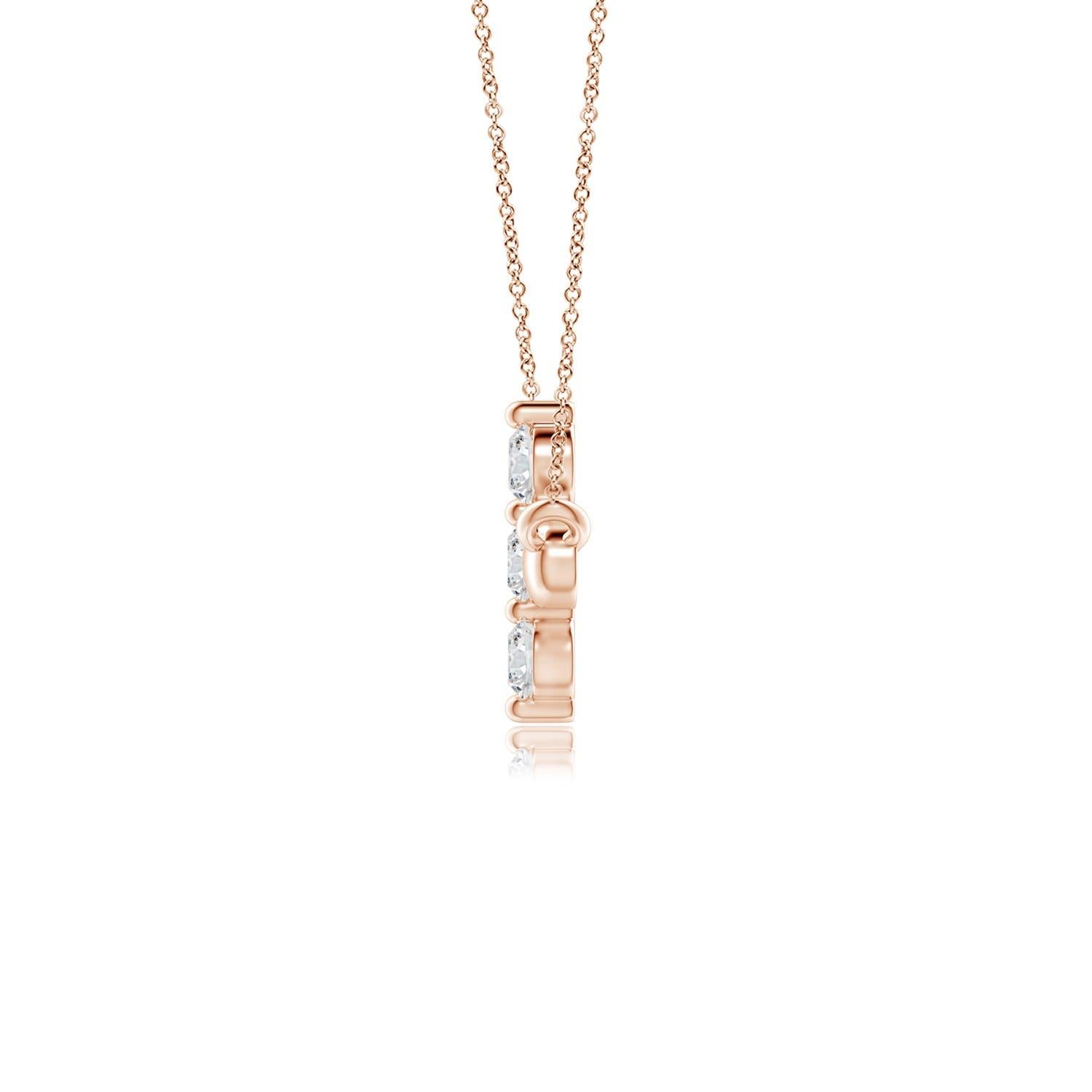 Hanging sideways from a chain is the gorgeous cross pendant crafted in 14k rose gold. The vertical bar of the cross is adorned with three white diamonds in prong setting. The sparkling diamonds lend an impeccable dazzling effect to this lustrous