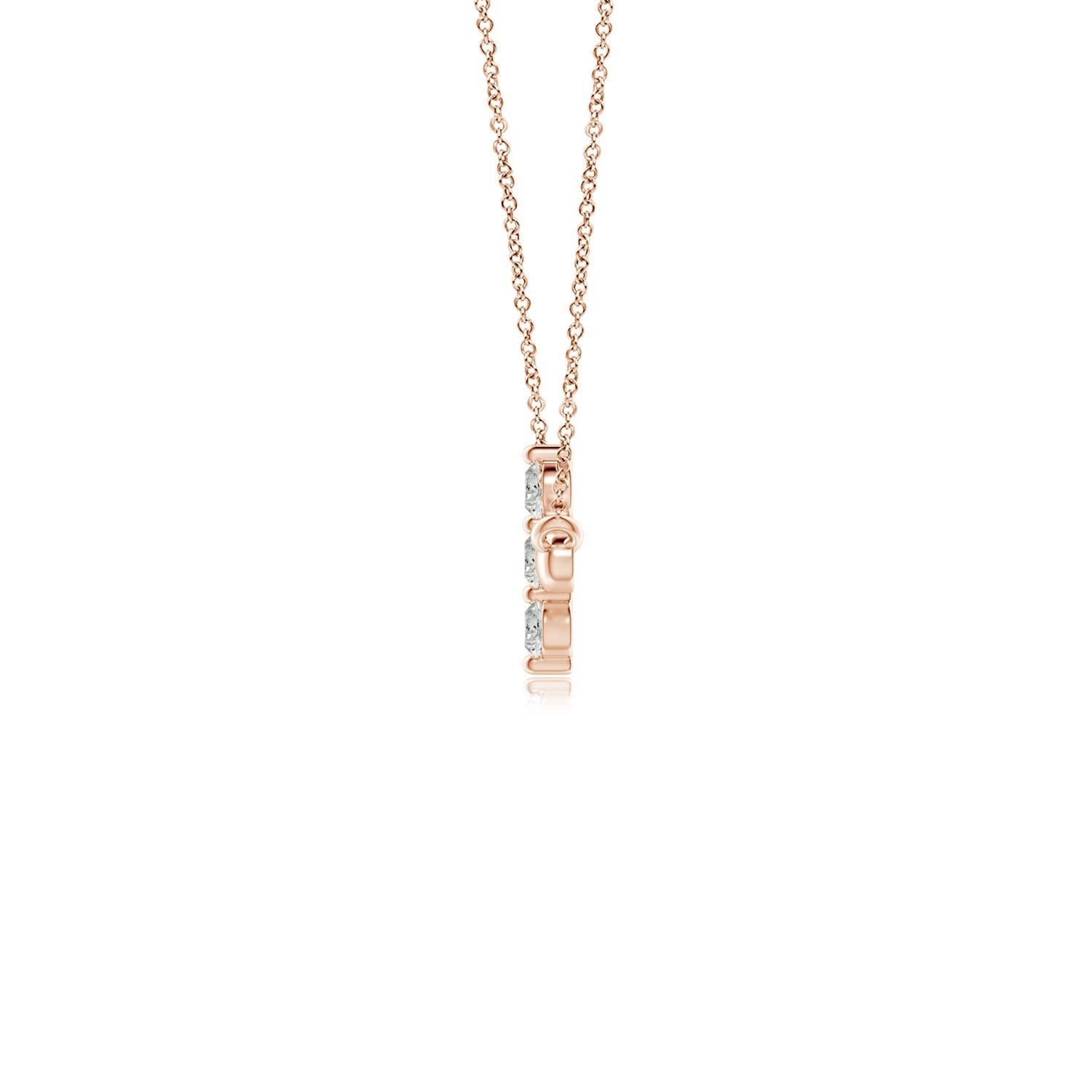 Hanging sideways from a chain is the gorgeous cross pendant crafted in 14k rose gold. The vertical bar of the cross is adorned with three white diamonds in prong setting. The sparkling diamonds lend an impeccable dazzling effect to this lustrous