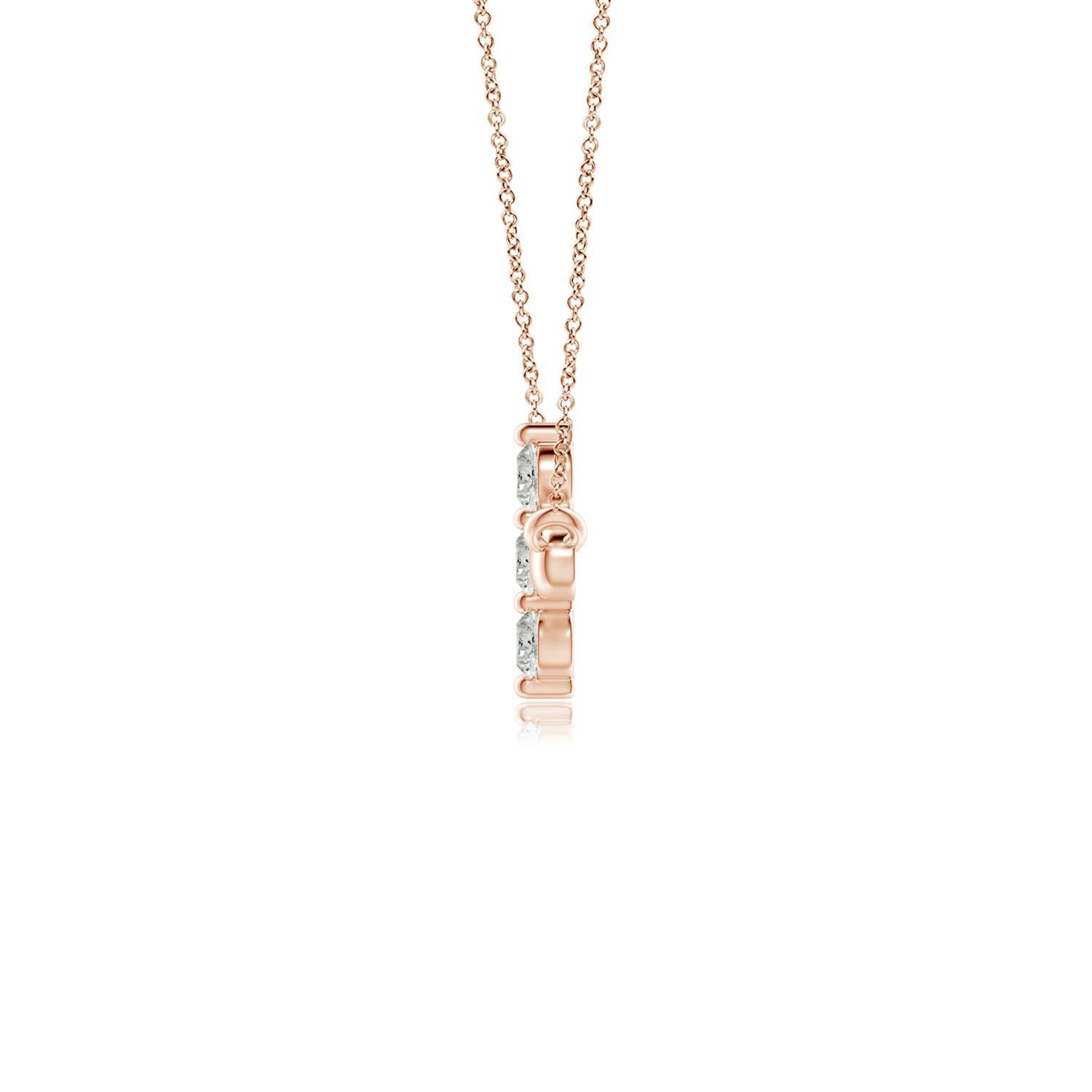 Hanging sideways from a chain is the gorgeous cross pendant crafted in 14k rose gold. The vertical bar of the cross is adorned with three white diamonds in prong setting. The sparkling diamonds lend an impeccable dazzling effect to this lustrous