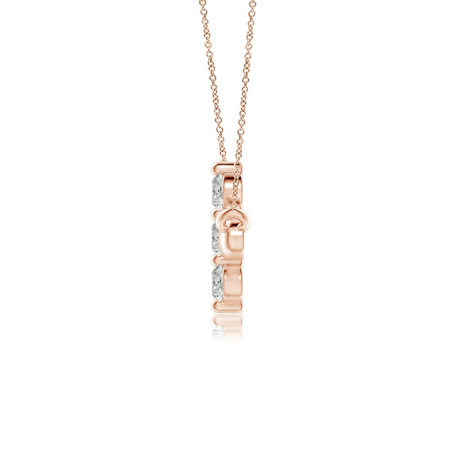 Hanging sideways from a chain is the gorgeous cross pendant crafted in 14k rose gold. The vertical bar of the cross is adorned with three white diamonds in prong setting. The sparkling diamonds lend an impeccable dazzling effect to this lustrous