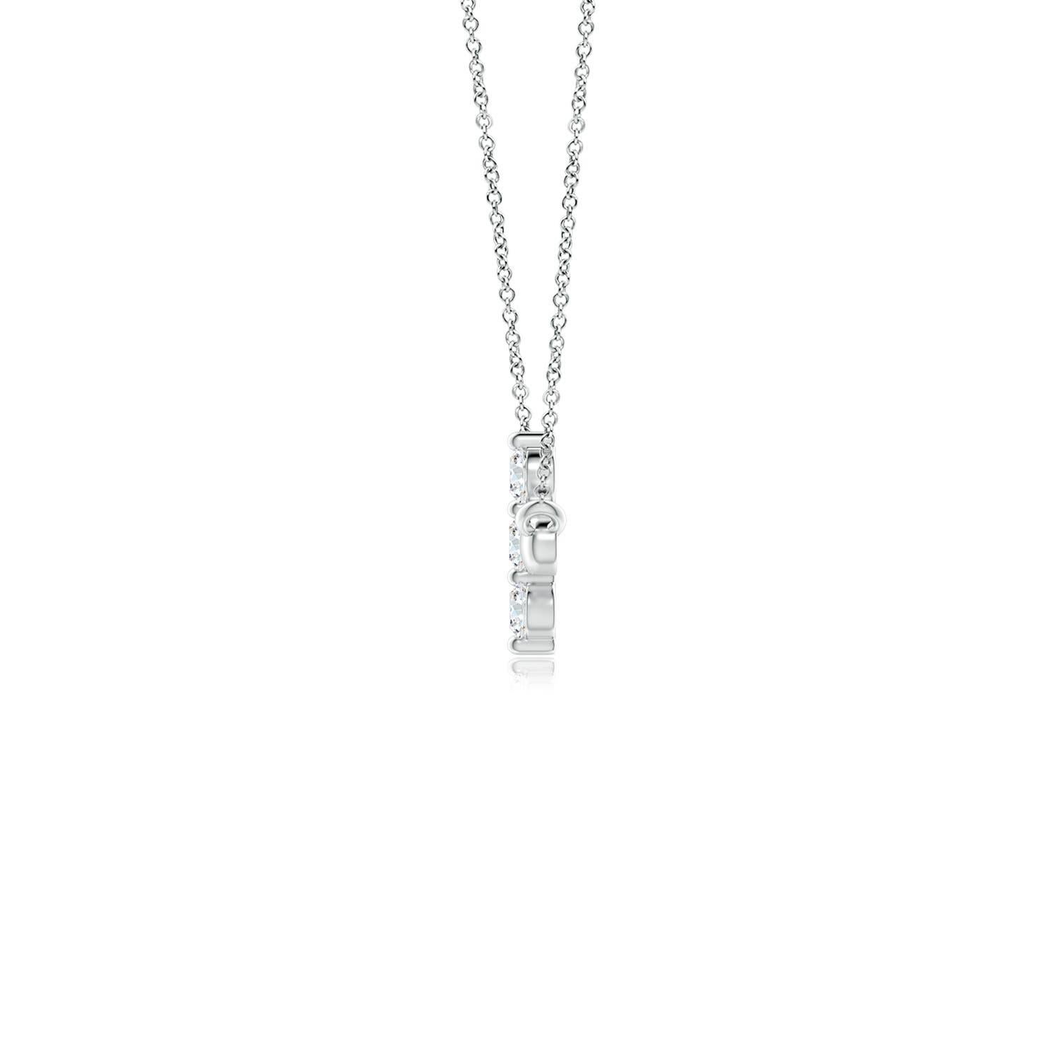 Hanging sideways from a chain is the gorgeous cross pendant crafted in 14k white gold. The vertical bar of the cross is adorned with three white diamonds in prong setting. The sparkling diamonds lend an impeccable dazzling effect to this lustrous