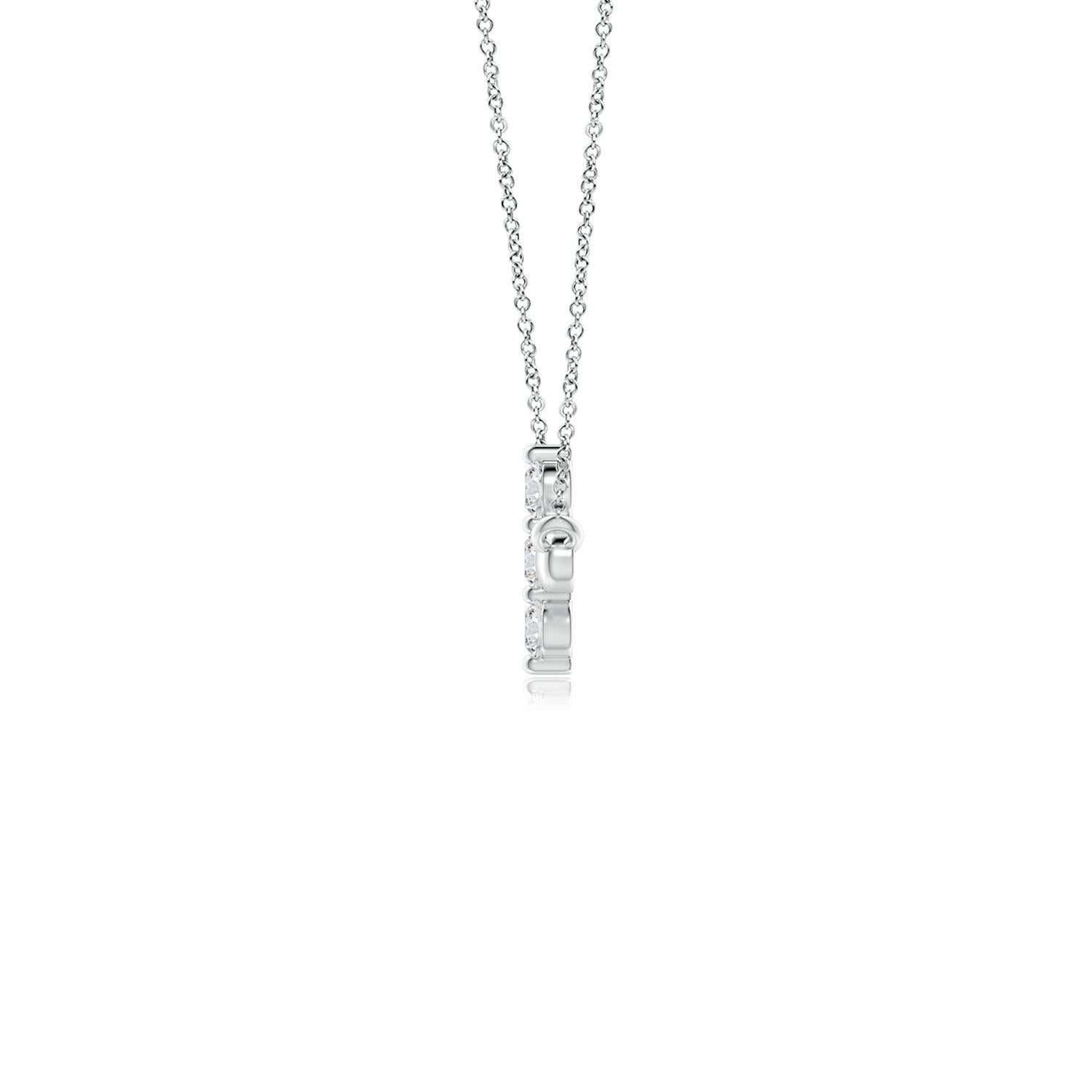 Hanging sideways from a chain is the gorgeous cross pendant crafted in 14k white gold. The vertical bar of the cross is adorned with three white diamonds in prong setting. The sparkling diamonds lend an impeccable dazzling effect to this lustrous