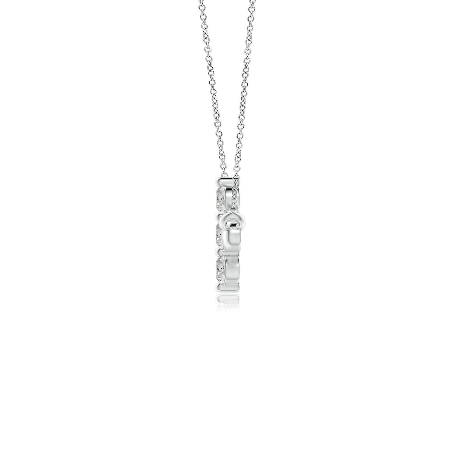 Hanging sideways from a chain is the gorgeous cross pendant crafted in 14k white gold. The vertical bar of the cross is adorned with three white diamonds in prong setting. The sparkling diamonds lend an impeccable dazzling effect to this lustrous