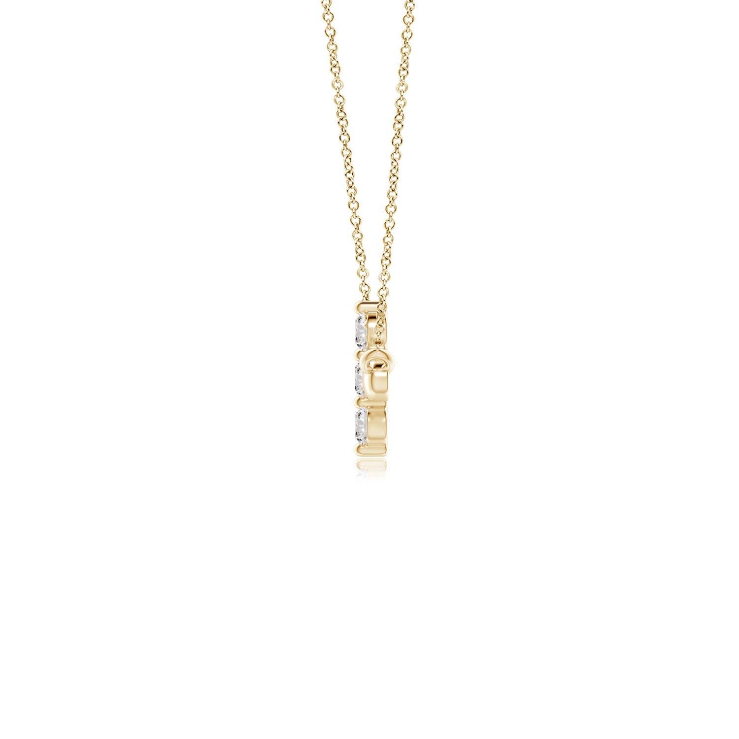 Hanging sideways from a chain is the gorgeous cross pendant crafted in 14k yellow gold. The vertical bar of the cross is adorned with three white diamonds in prong setting. The sparkling diamonds lend an impeccable dazzling effect to this lustrous