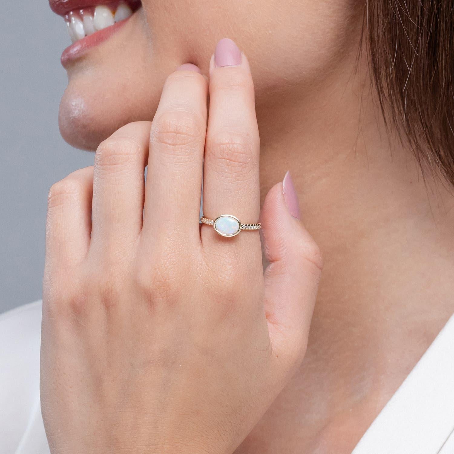 Modern Angara Natural East-West Bezel-Set Oval Opal and Diamond Ring in 14K Solid Gold For Sale