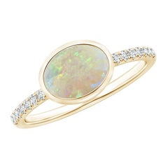 Angara Natural East-West Bezel-Set Oval Opal and Diamond Ring in 14K Solid Gold