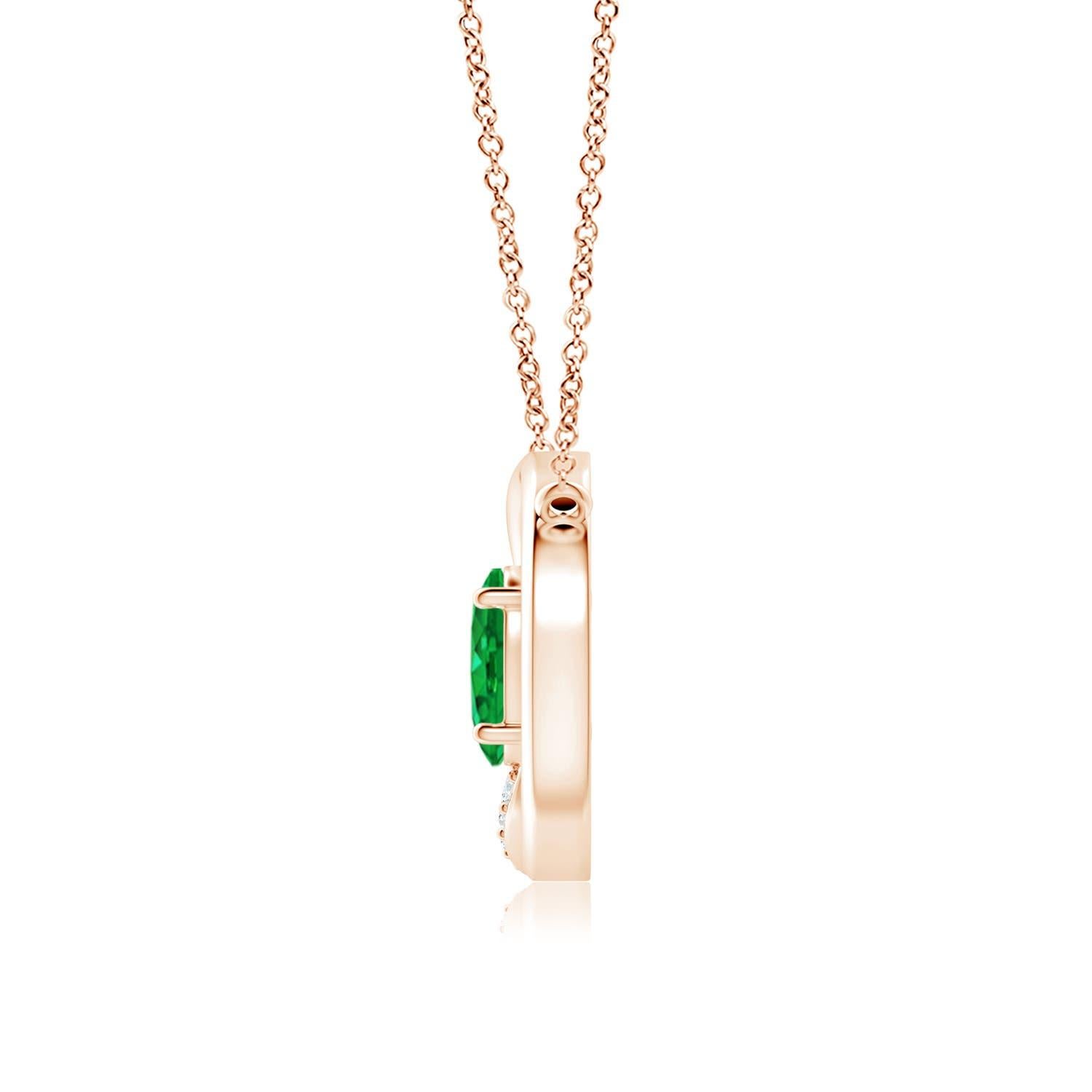 Featuring interlocking circles, this emerald pendant necklace makes a lasting impression. At the centre of the design, sits an oval prong-set emerald that enthrals with its lively vigor. One of the two circles in this intertwined circle necklace is