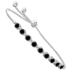 Pulsera Bolo de Tenis de Diamantes Blancos y Negros con Realce Natural Angara en Oro de 14 K