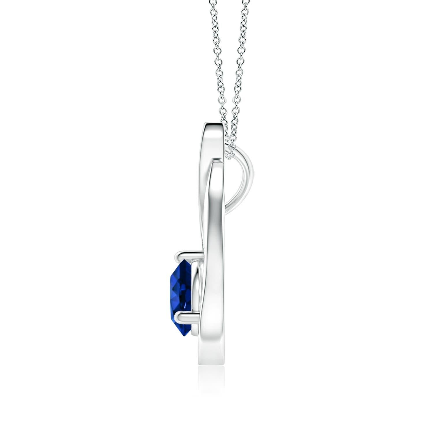 Un pendentif tulipe en platine orné d'un saphir bleu qui vous envoûtera par son éclat divin. Le modèle présente un saphir rond serti sur un anneau et des accents de diamant qui complètent magnifiquement l'éclat de la pierre précieuse, semblable à